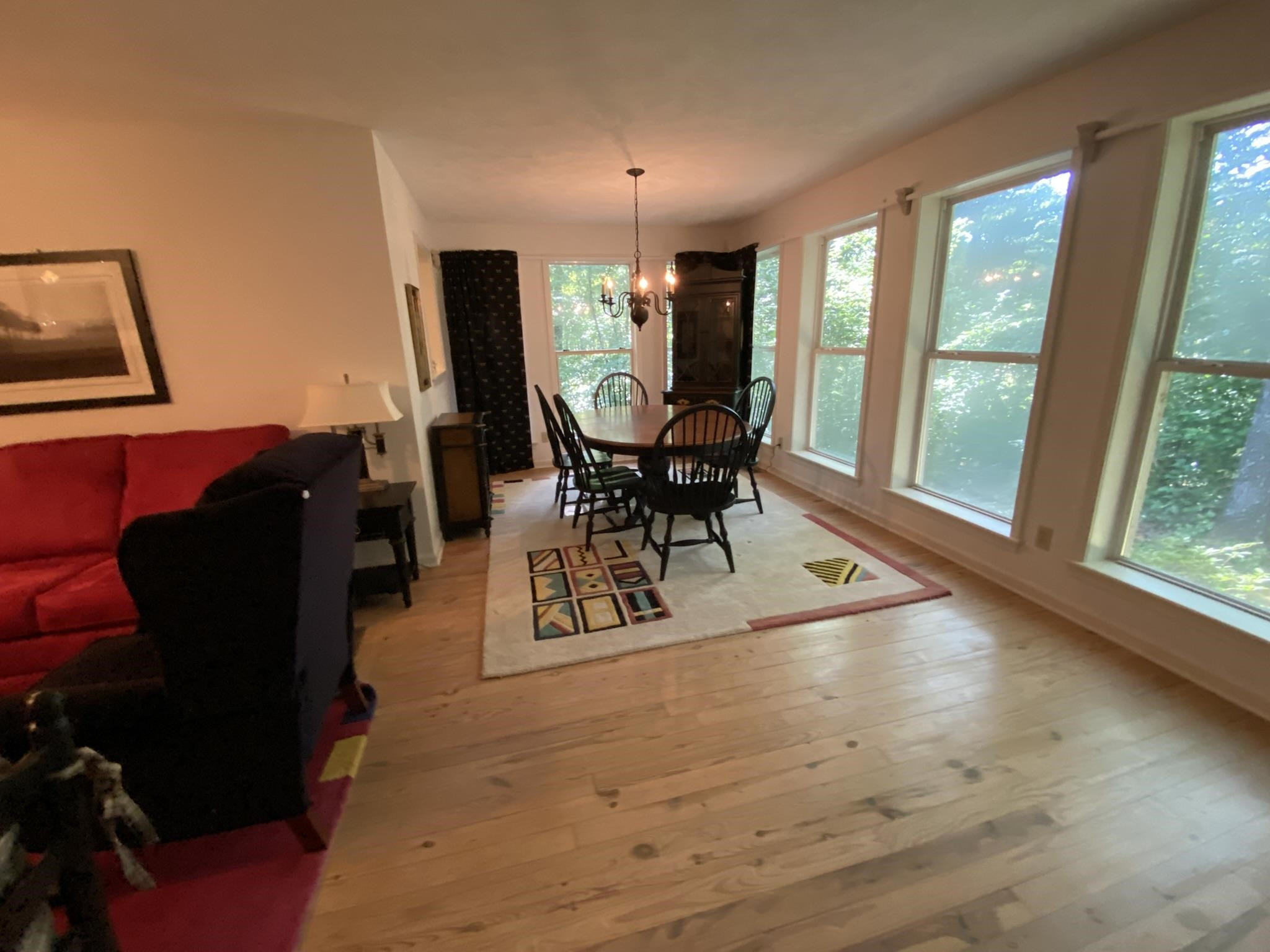 70 Mockingbird Road Henderson, TN 38340 - Photo 9 of 47 a dining room with wooden floor a glass table and chairs