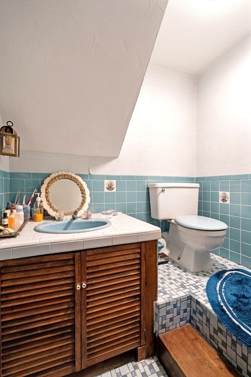 60 Beaten Road Dennis, MA 02639 - Photo 13 of 26 a bathroom with a sink and a toilet
