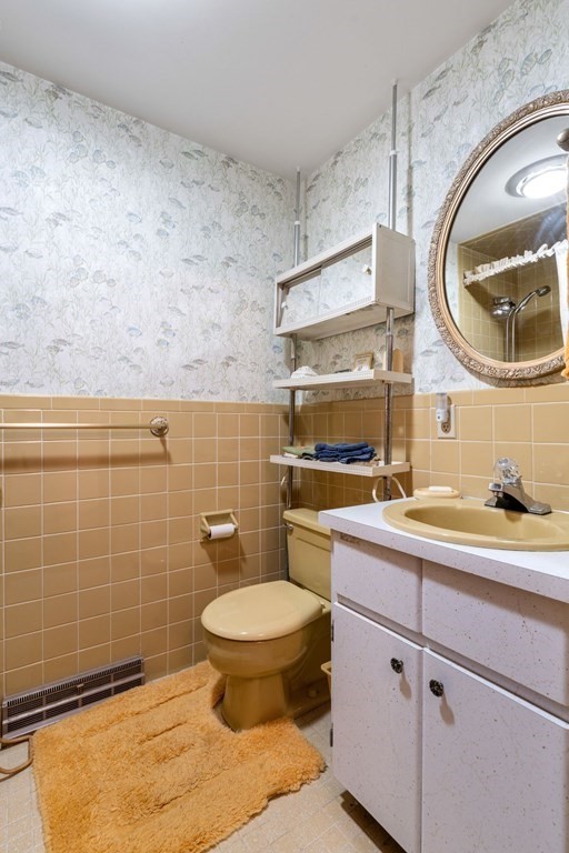 60 Beaten Road Dennis, MA 02639 - Photo 14 of 26 a bathroom with a sink a toilet and a mirror