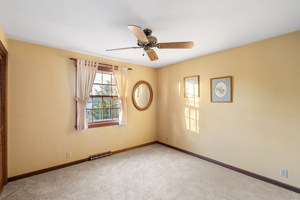 60 Beaten Road Dennis, MA 02639 - Photo 15 of 26 an empty room with windows and fan