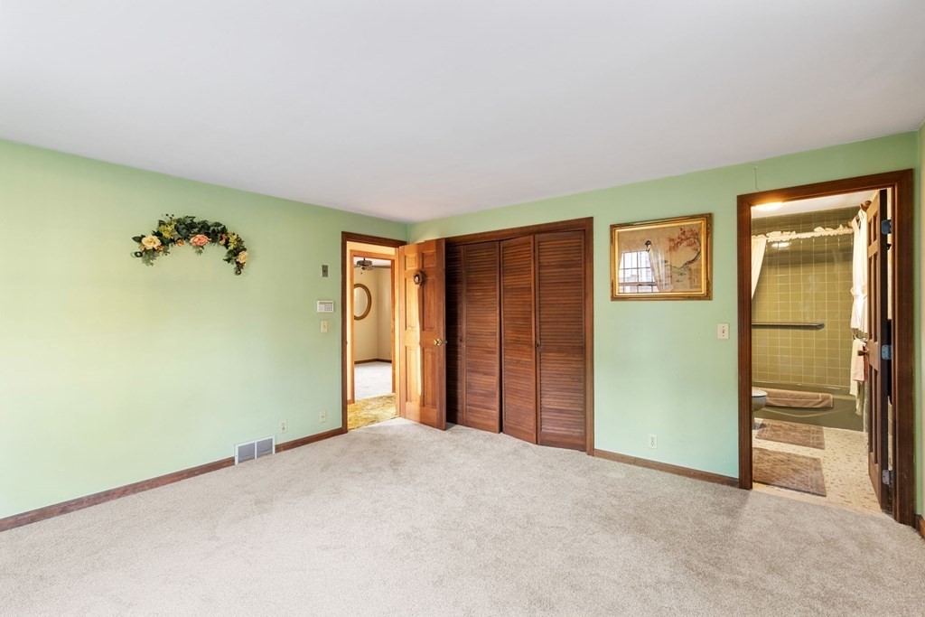 60 Beaten Road Dennis, MA 02639 - Photo 18 of 26 an empty room with closet and a chandelier fan