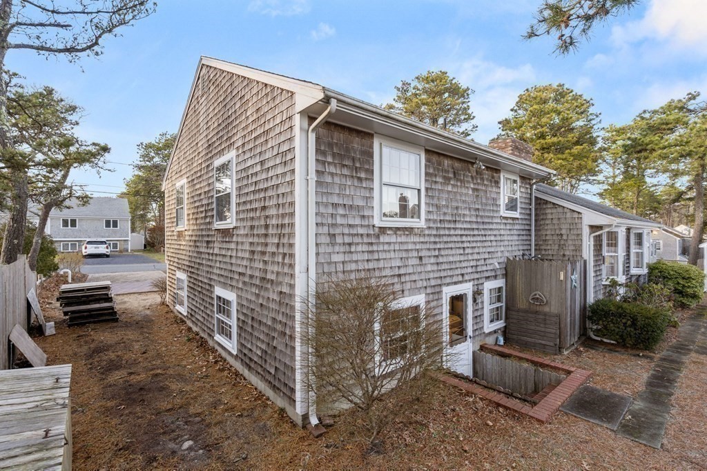 60 Beaten Road Dennis, MA 02639 - Photo 23 of 26 a view of a house with a yard
