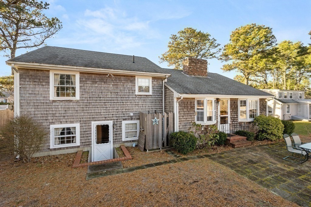 60 Beaten Road Dennis, MA 02639 - Photo 24 of 26 a front view of a house with garden