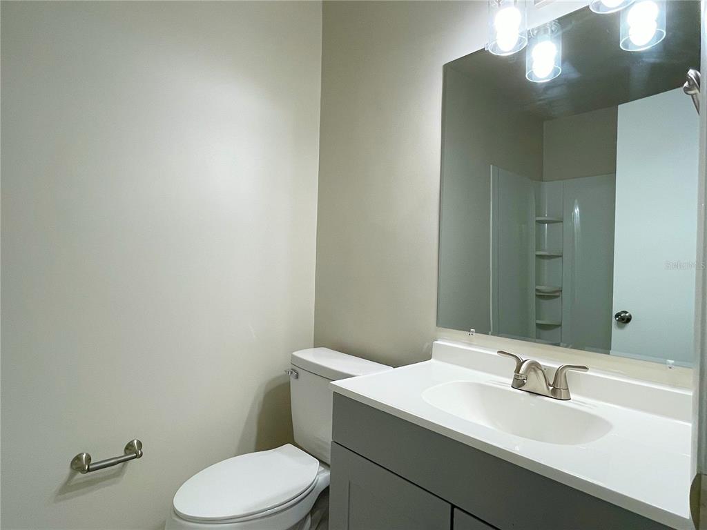 702 St Matthew Circle Altamonte Springs, FL 32714 - Photo 15 of 27 a bathroom with a sink vanity mirror and toilet