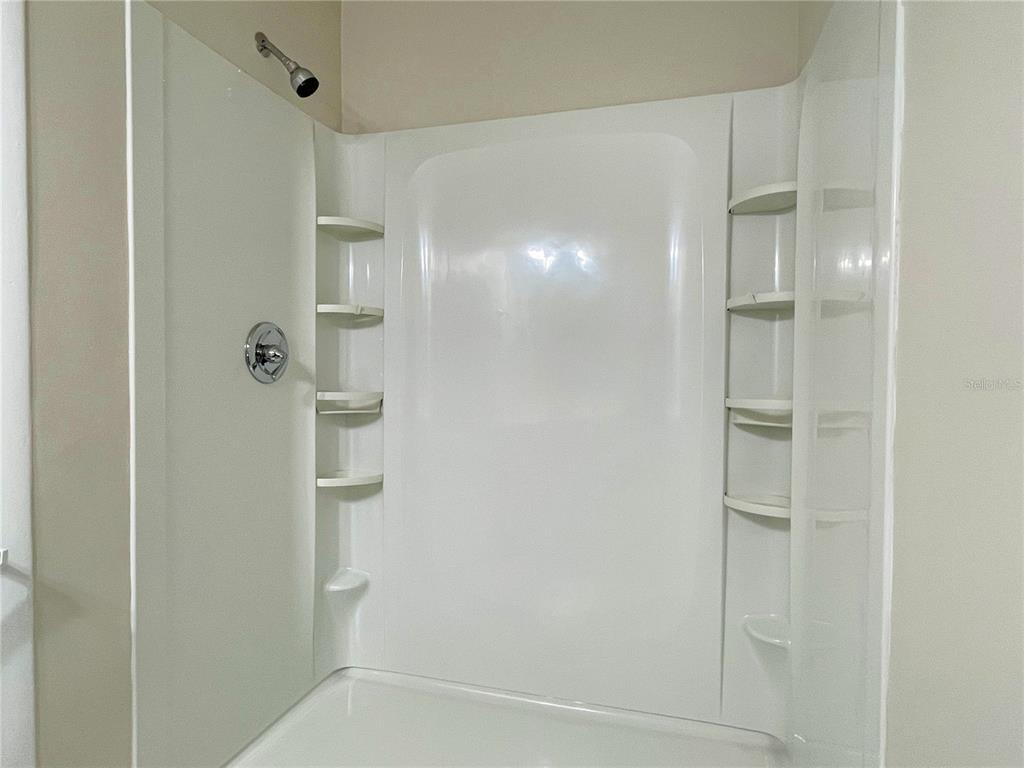 702 St Matthew Circle Altamonte Springs, FL 32714 - Photo 16 of 27 a bathroom with a glass shower door