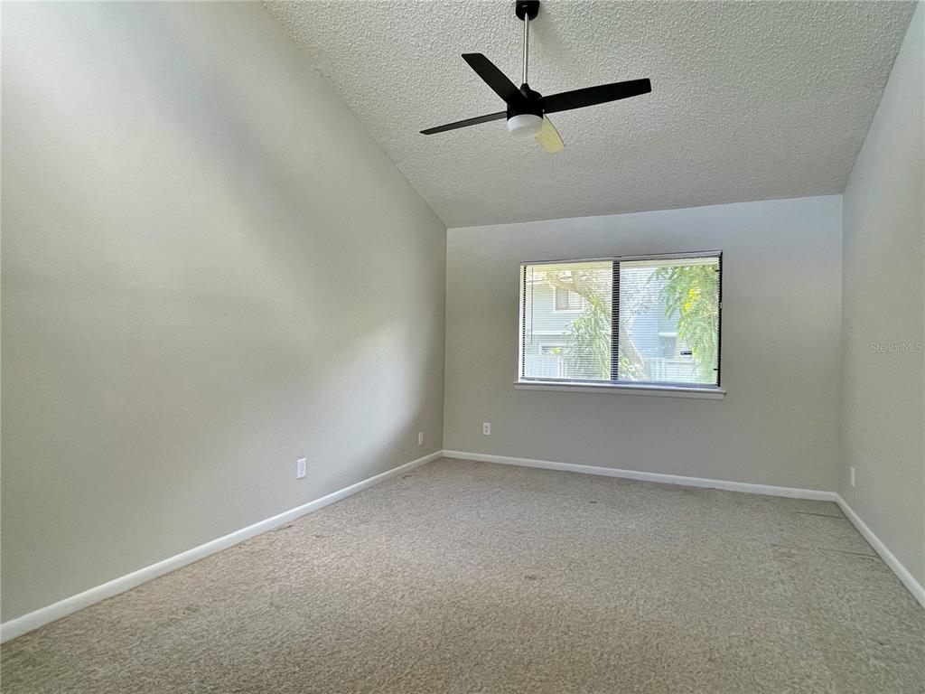 702 St Matthew Circle Altamonte Springs, FL 32714 - Photo 17 of 27 an empty room with a window