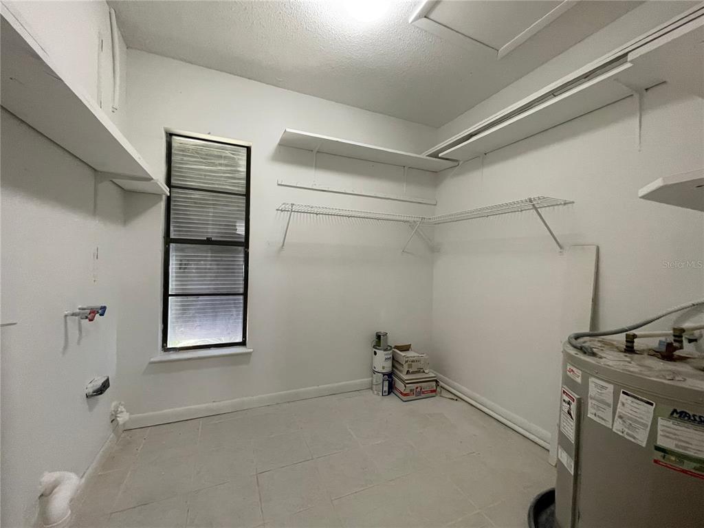 702 St Matthew Circle Altamonte Springs, FL 32714 - Photo 21 of 27 a view of a room with rack on the wall and a window