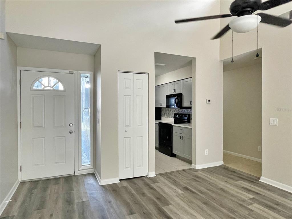 702 St Matthew Circle Altamonte Springs, FL 32714 - Photo 3 of 27 a view of a kitchen with a refrigerator and a stove top oven