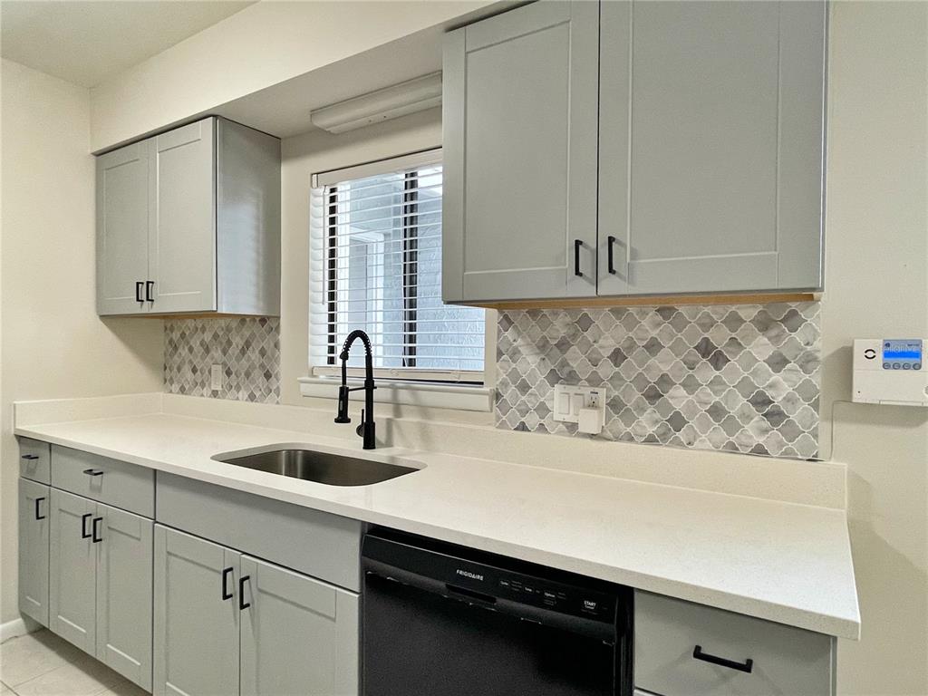 702 St Matthew Circle Altamonte Springs, FL 32714 - Photo 8 of 27 a kitchen with a sink and cabinets
