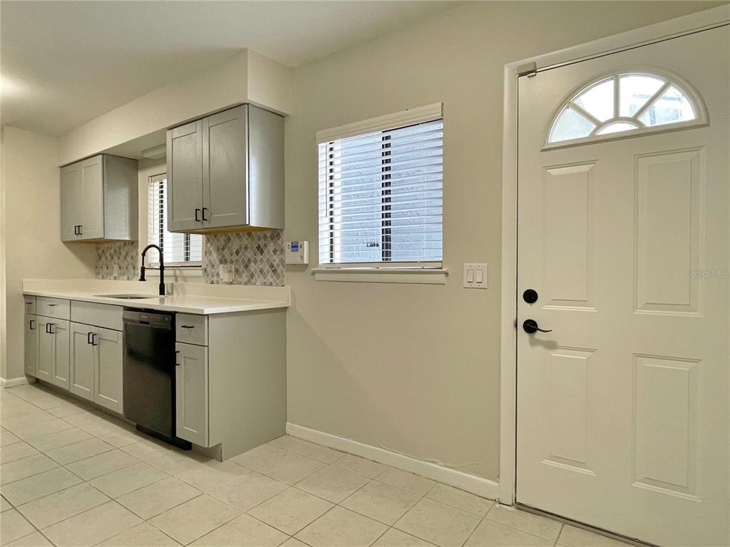 702 St Matthew Circle Altamonte Springs, FL 32714 - Photo 9 of 27 a kitchen with a sink cabinets and window