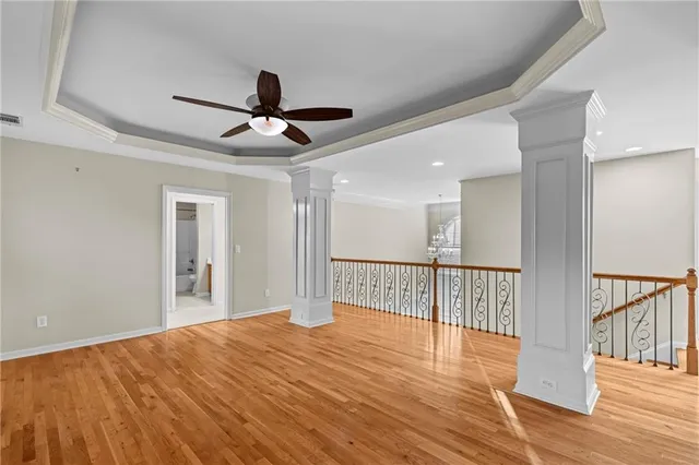 a view of a room with wooden floor