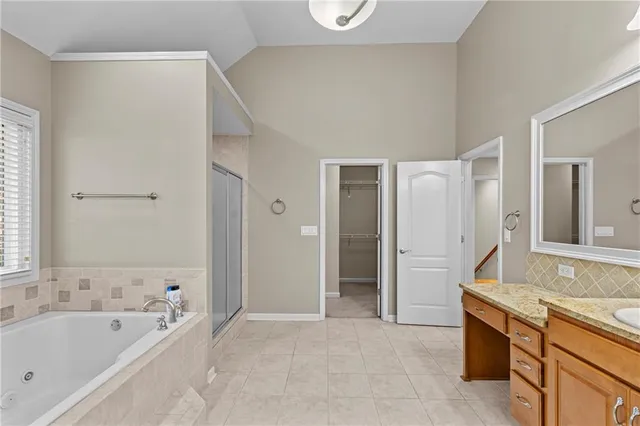 a bathroom with a bathtub and shower