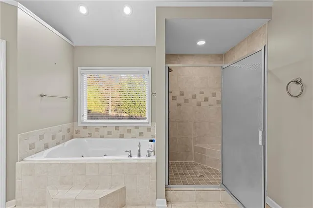 an empty room with window ceiling fan and a livingroom