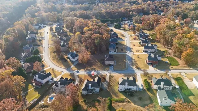 an aerial view of residential houses with outdoor space