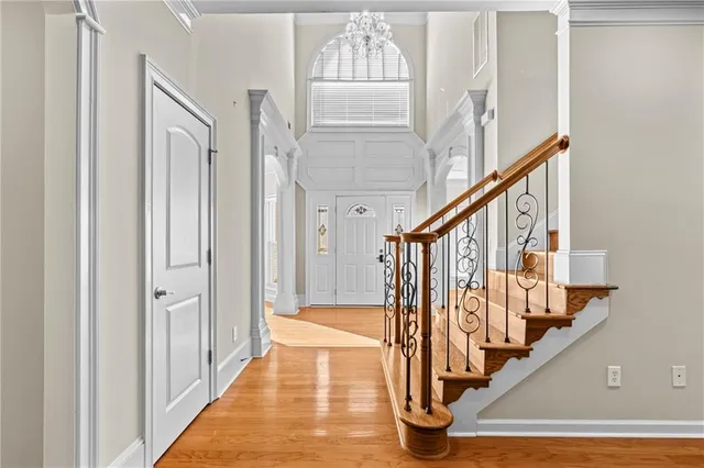 a view of an entryway with wooden floor