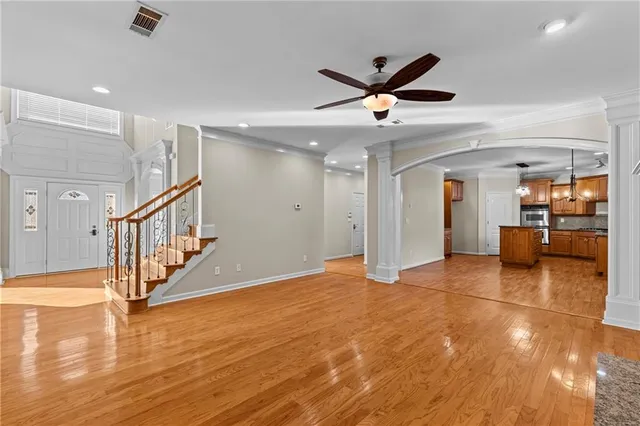 a view of an entryway with wooden floor