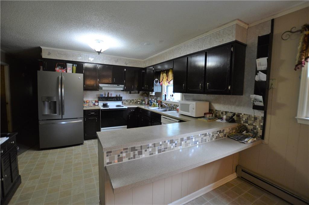 4096 Beach Road, Unit 7 Hudson, NC 28638 - Photo 5 of 13 a kitchen with a refrigerator and a sink