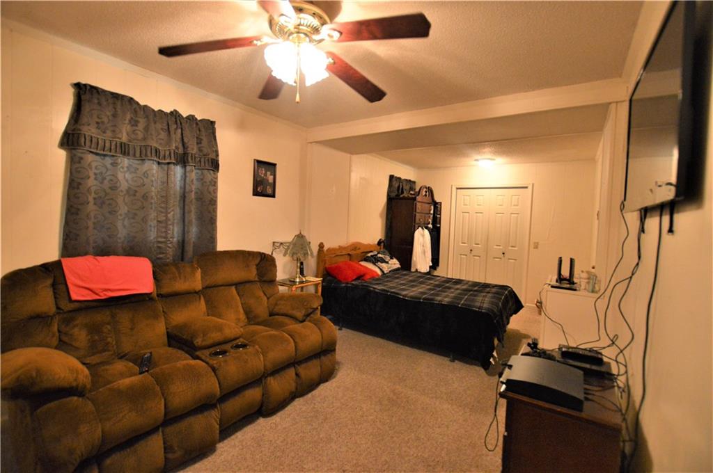 4096 Beach Road, Unit 7 Hudson, NC 28638 - Photo 8 of 13 a living room with furniture and a flat screen tv