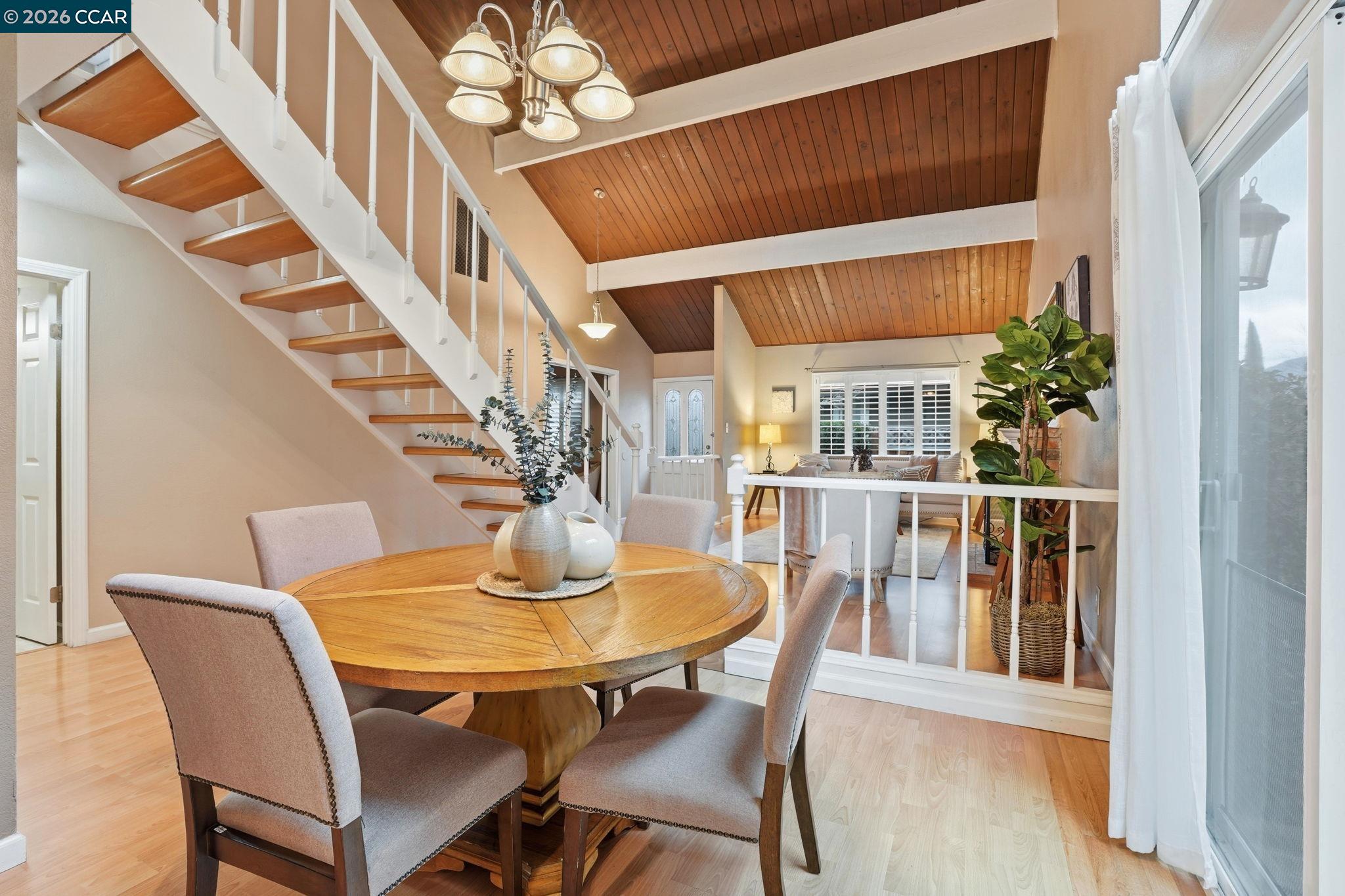 a view of a dining room with furniture and a table