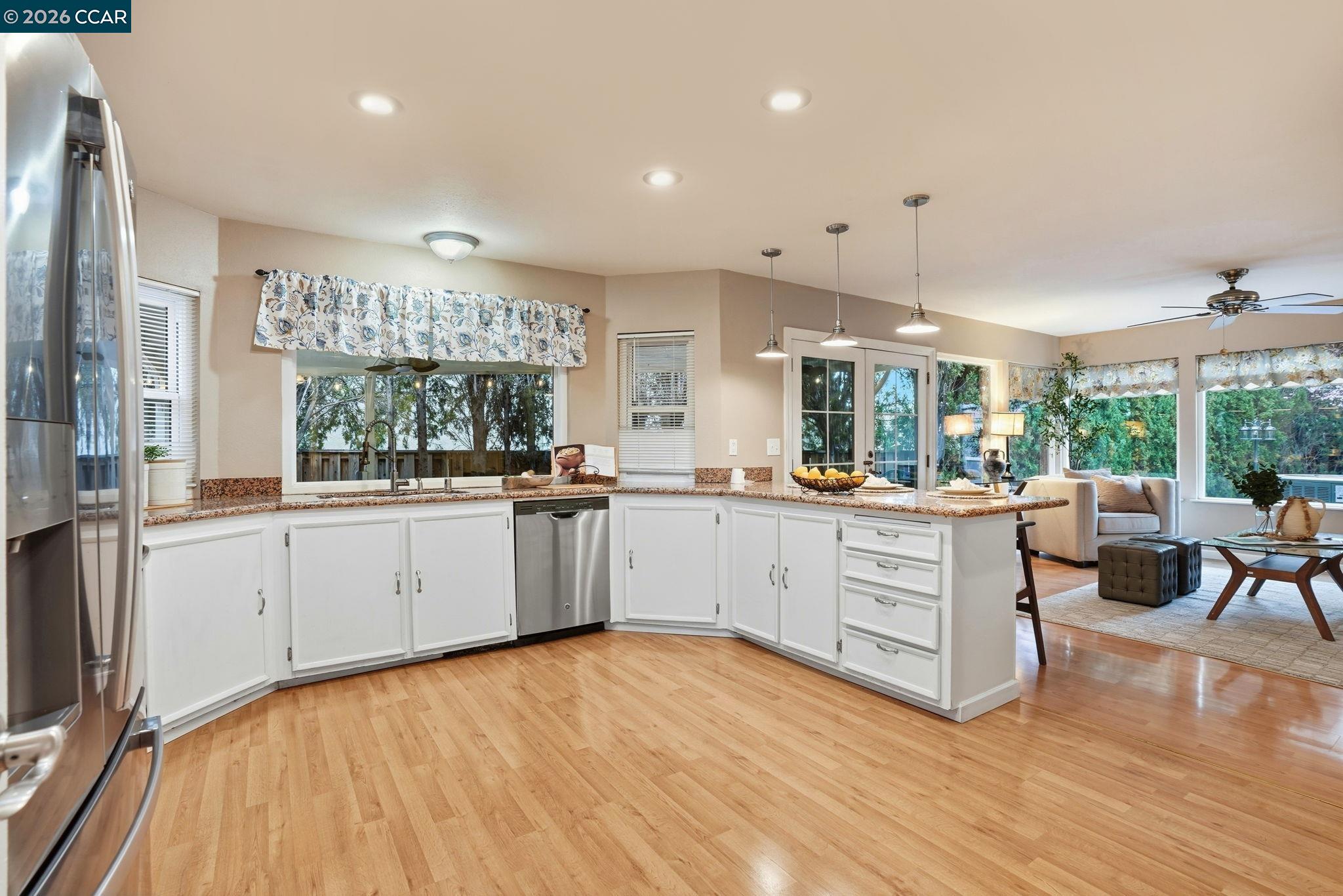 5454 Anselmo Court Concord, CA 94521 - Photo 11 of 44 a kitchen with white cabinets and white appliances
