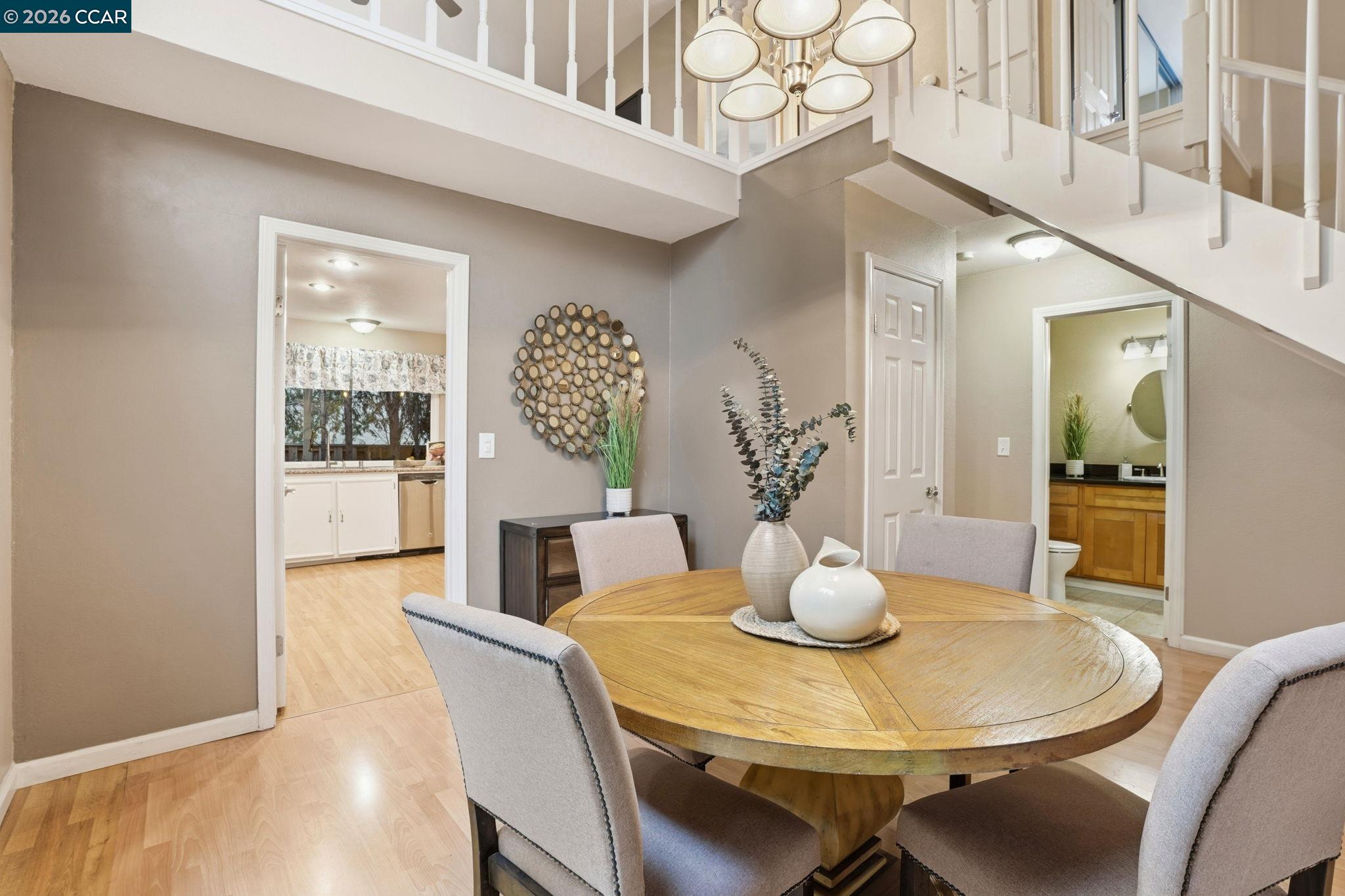 5454 Anselmo Court Concord, CA 94521 - Photo 16 of 44 a dining room with furniture and wooden floor