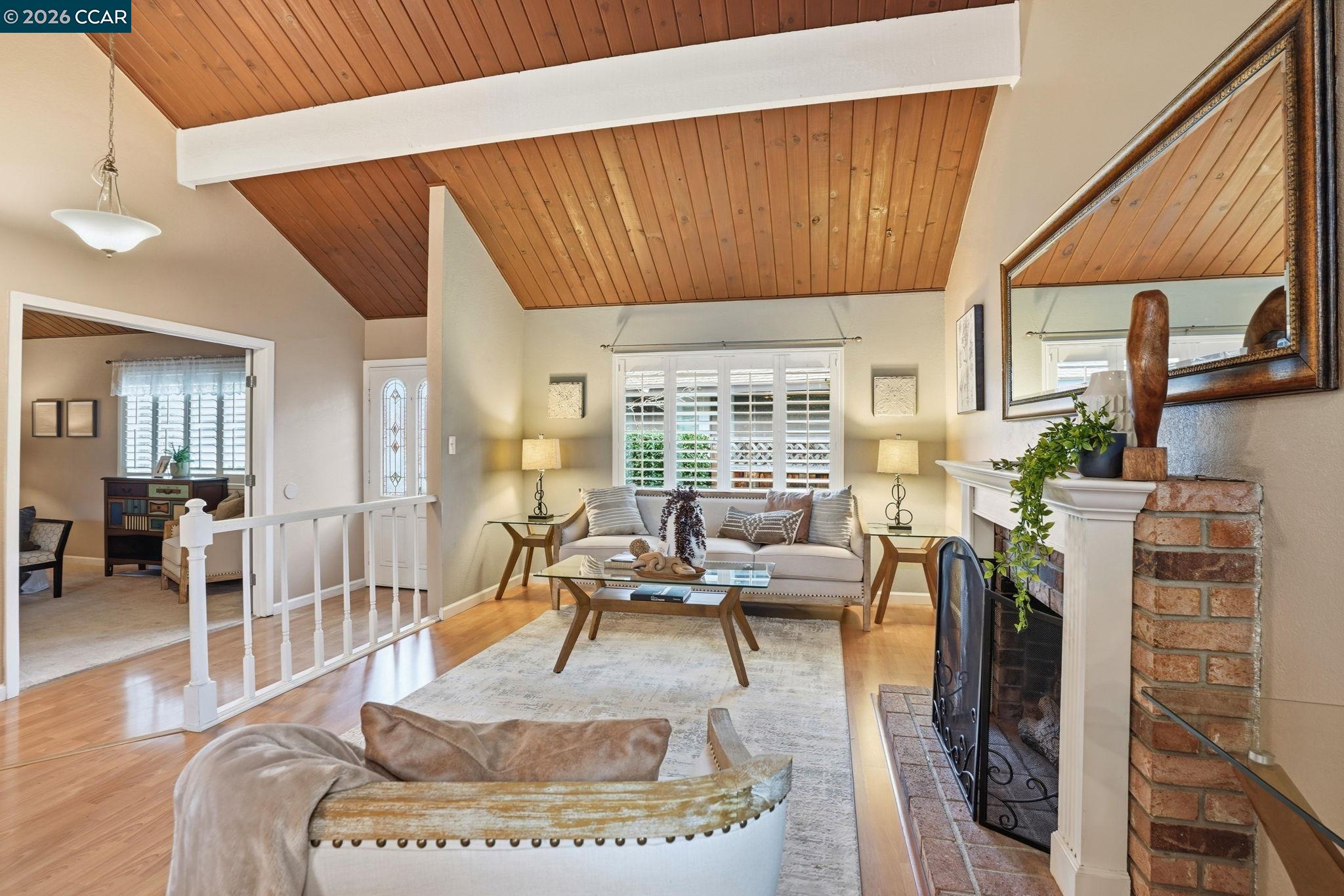 5454 Anselmo Court Concord, CA 94521 - Photo 6 of 44 a living room with furniture a large window and wooden floor