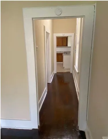 a kitchen with granite countertop a sink cabinets and stainless steel appliances