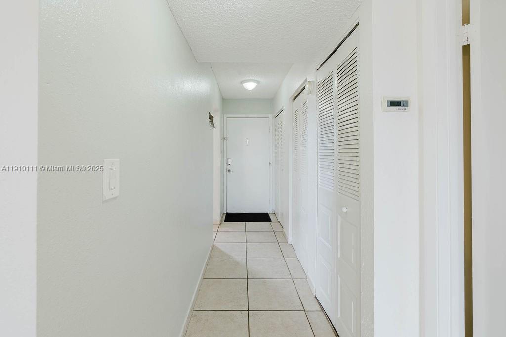 3110 North Pine Island Road, Unit 409 Sunrise, FL 33351 - Photo 12 of 18 a view of a hallway