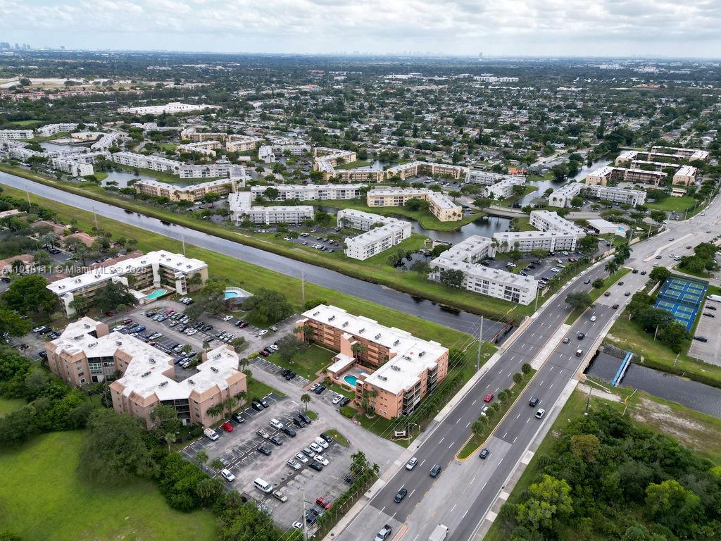 3110 North Pine Island Road, Unit 409 Sunrise, FL 33351 - Photo 16 of 18 an aerial view of a city