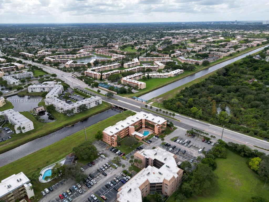 3110 North Pine Island Road, Unit 409 Sunrise, FL 33351 - Photo 17 of 18 an aerial view of a city with lots of residential buildings