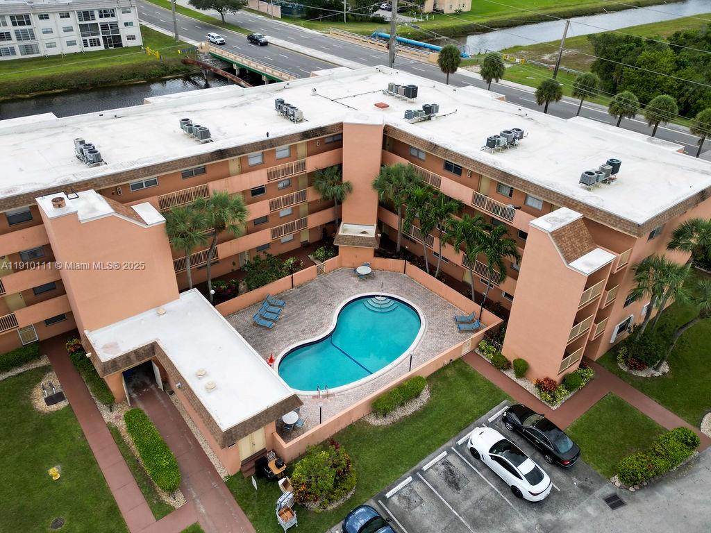 3110 North Pine Island Road, Unit 409 Sunrise, FL 33351 - Photo 18 of 18 an aerial view of a house with a yard