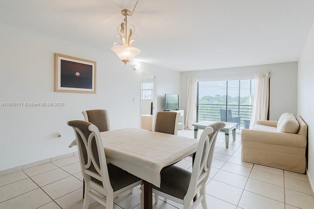 3110 North Pine Island Road, Unit 409 Sunrise, FL 33351 - Photo 10 of 18 a view of a dining room with furniture window and outside view
