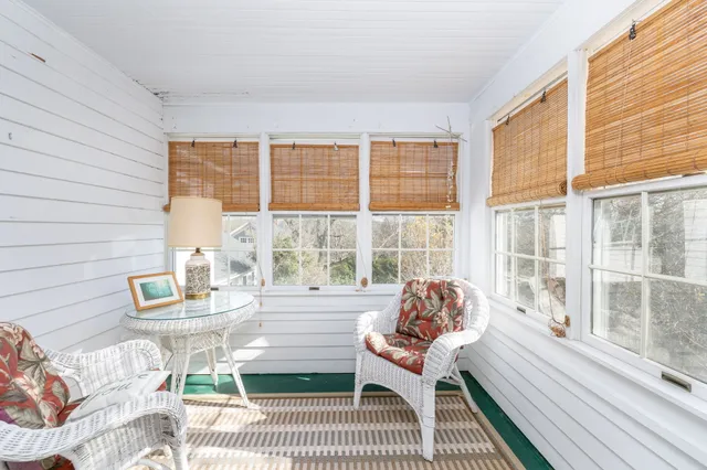a bathroom with a toilet a sink and a mirror