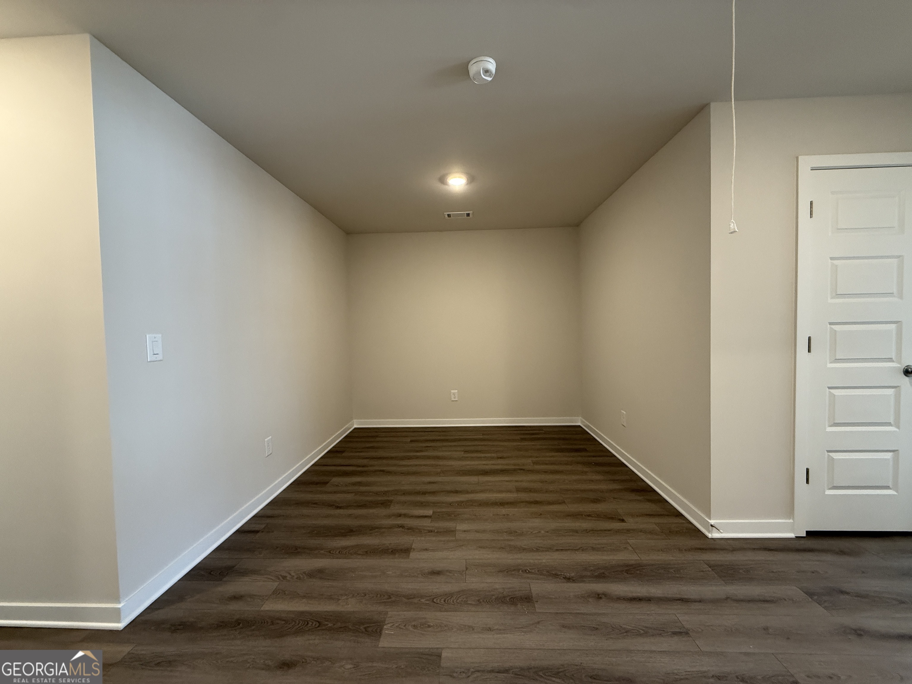 182 Depot Landing Road, Unit 65A Auburn, GA 30011 - Photo 13 of 36 a view of empty room with wooden floor