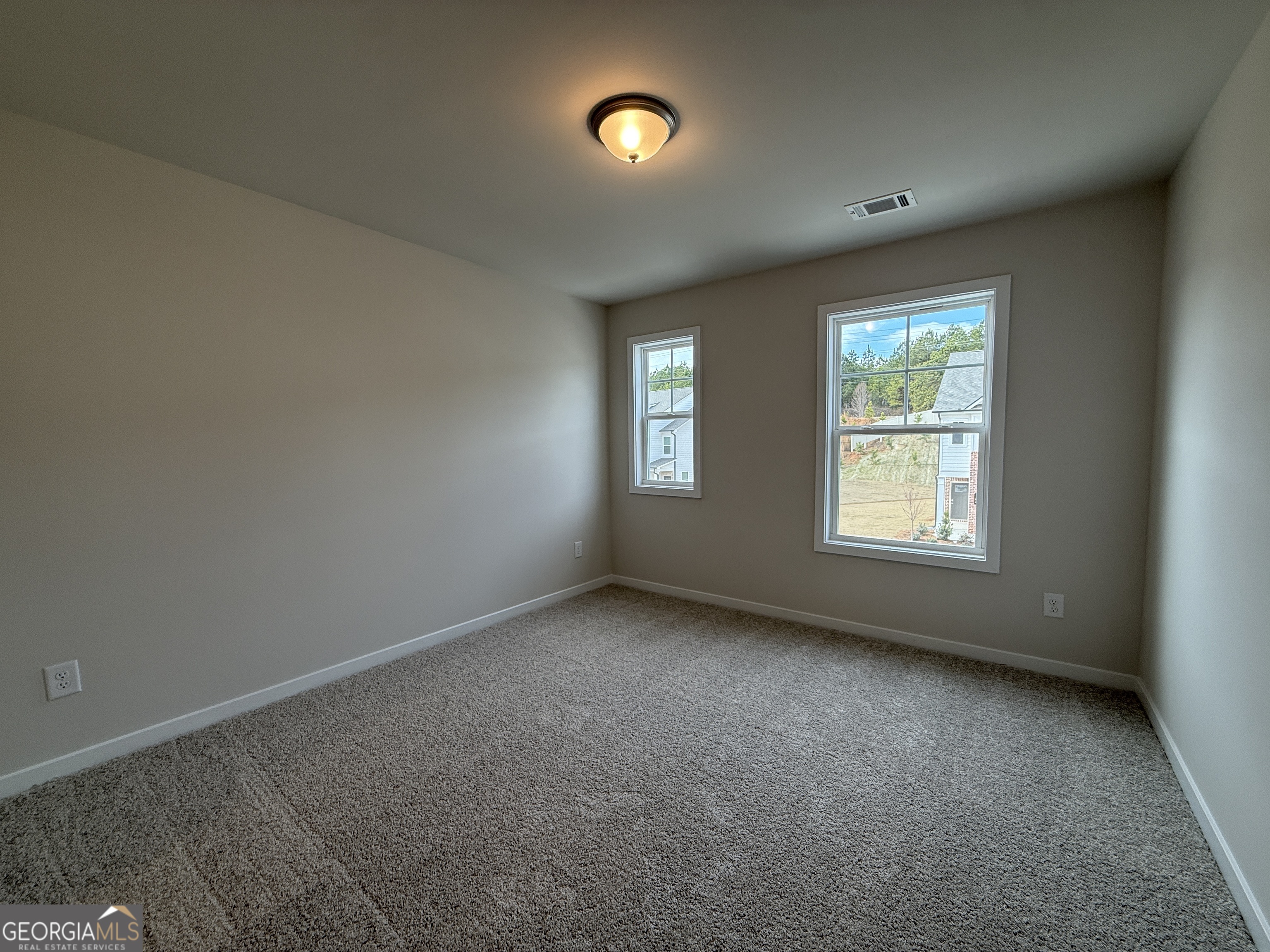 182 Depot Landing Road, Unit 65A Auburn, GA 30011 - Photo 15 of 36 an empty room with windows and closet