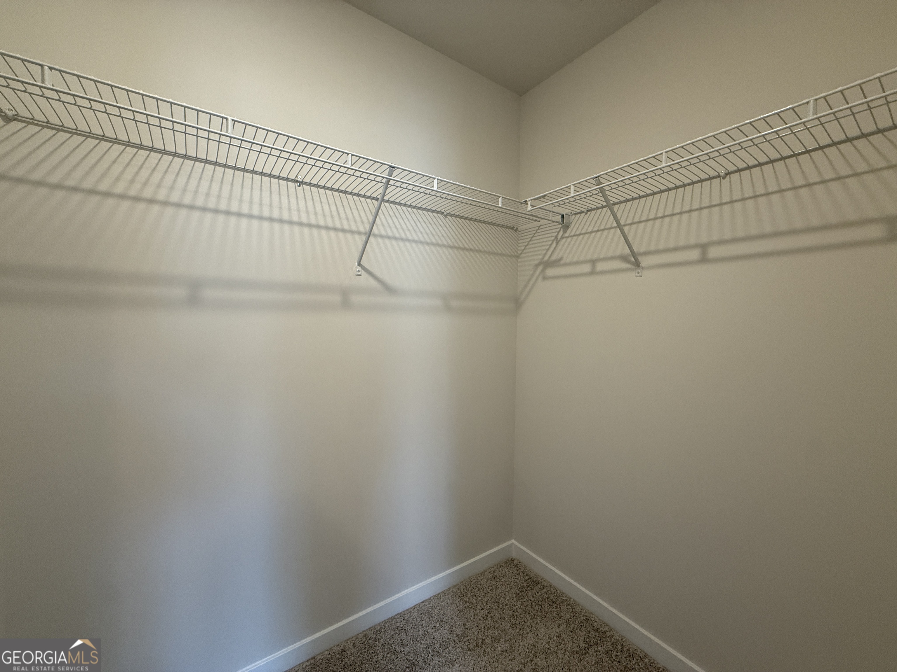 182 Depot Landing Road, Unit 65A Auburn, GA 30011 - Photo 16 of 36 a view of a room with racks on the wall