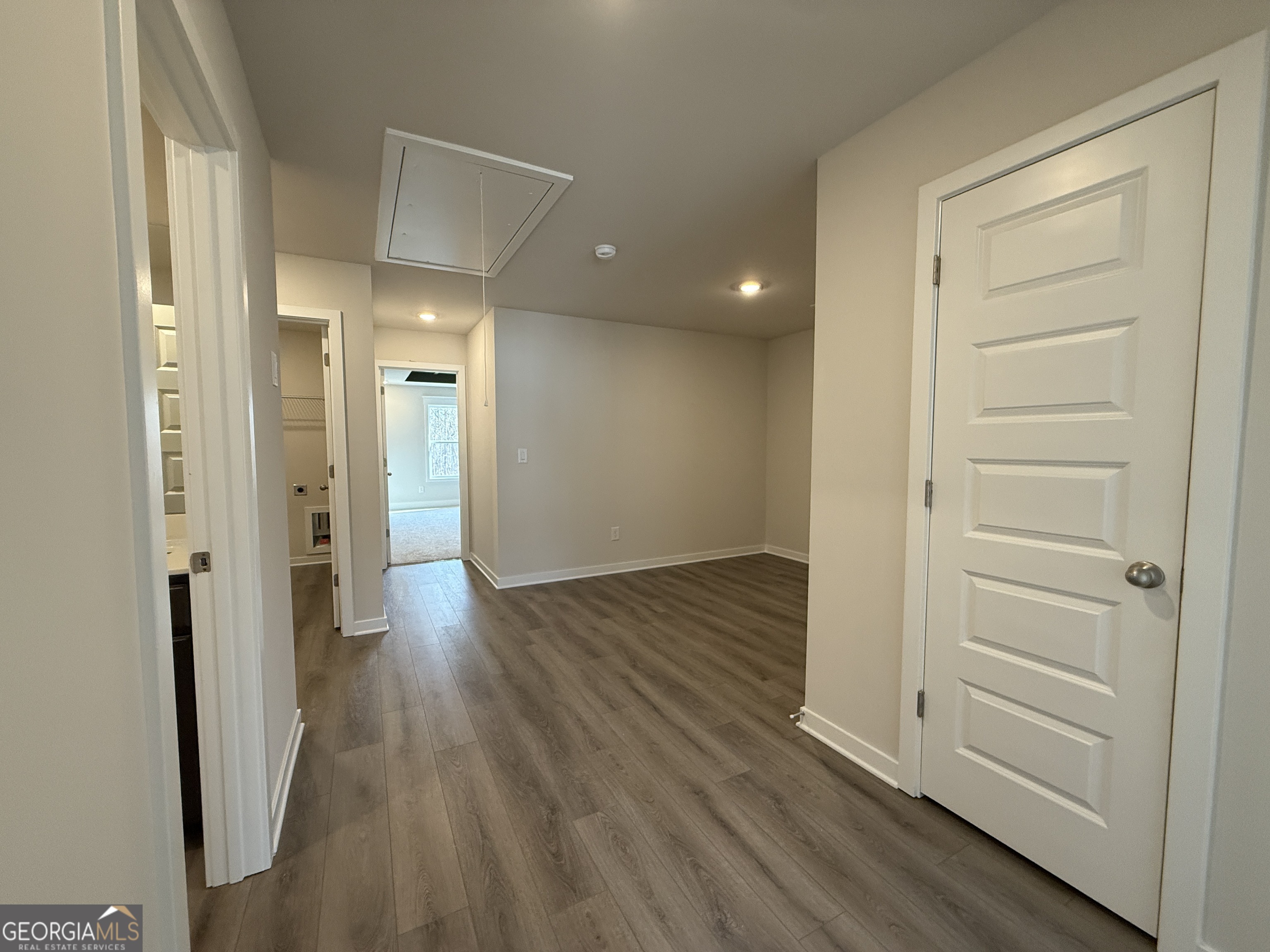 182 Depot Landing Road, Unit 65A Auburn, GA 30011 - Photo 19 of 36 a view of a hallway with wooden floor