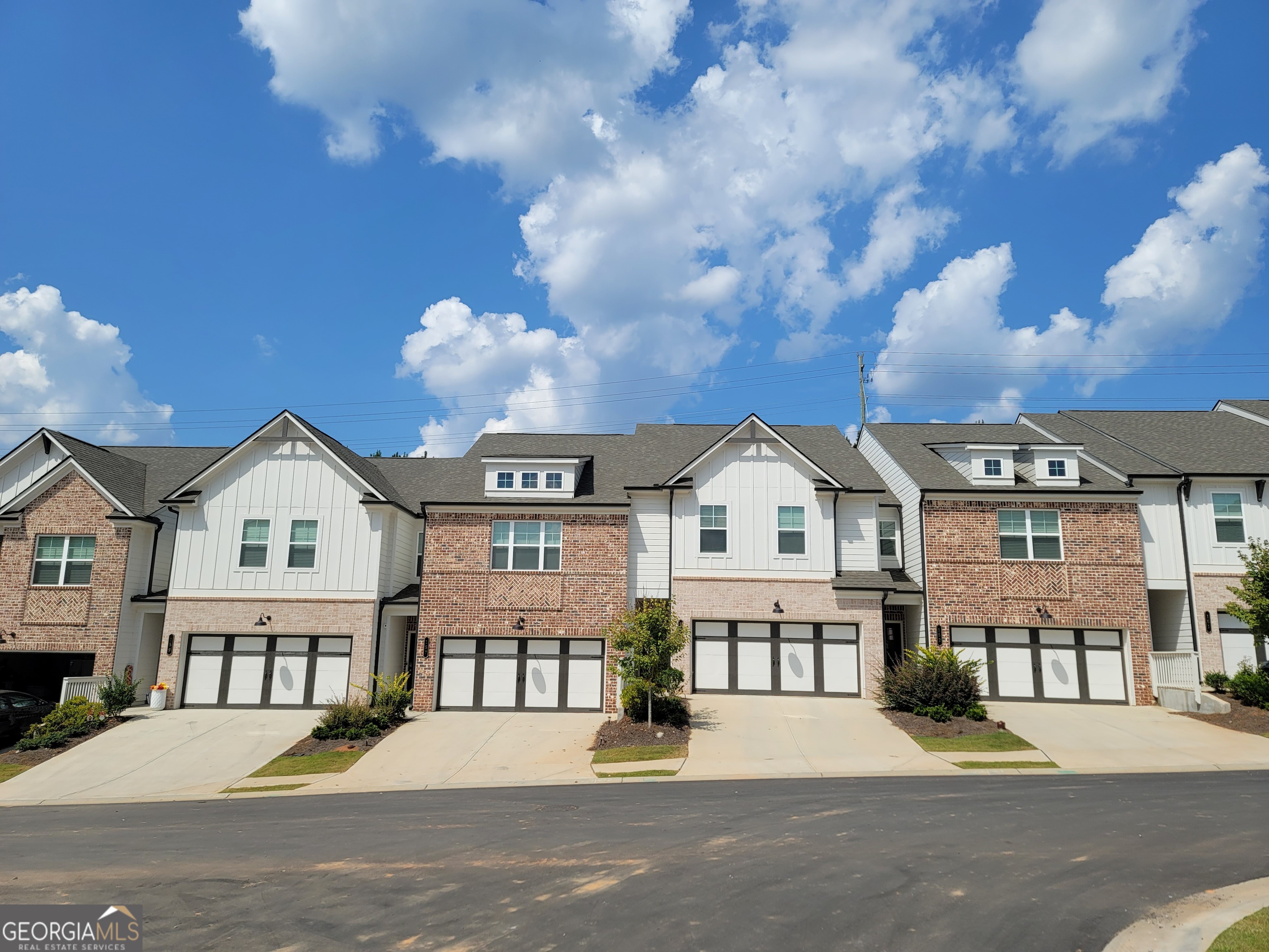 182 Depot Landing Road, Unit 65A Auburn, GA 30011 - Photo 2 of 37 a view of multiple houses with a street