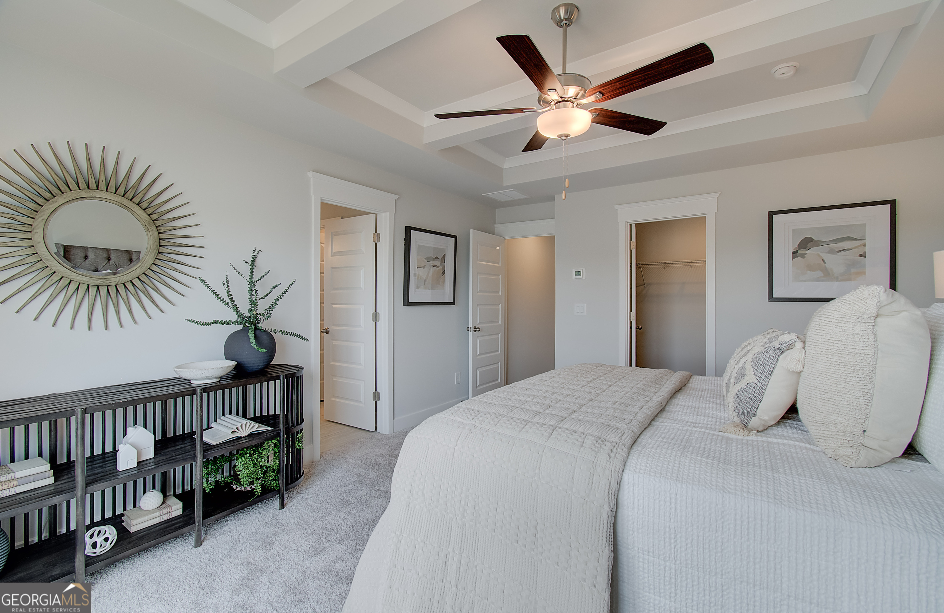 182 Depot Landing Road, Unit 65A Auburn, GA 30011 - Photo 23 of 37 a bedroom with a large bed and a chandelier