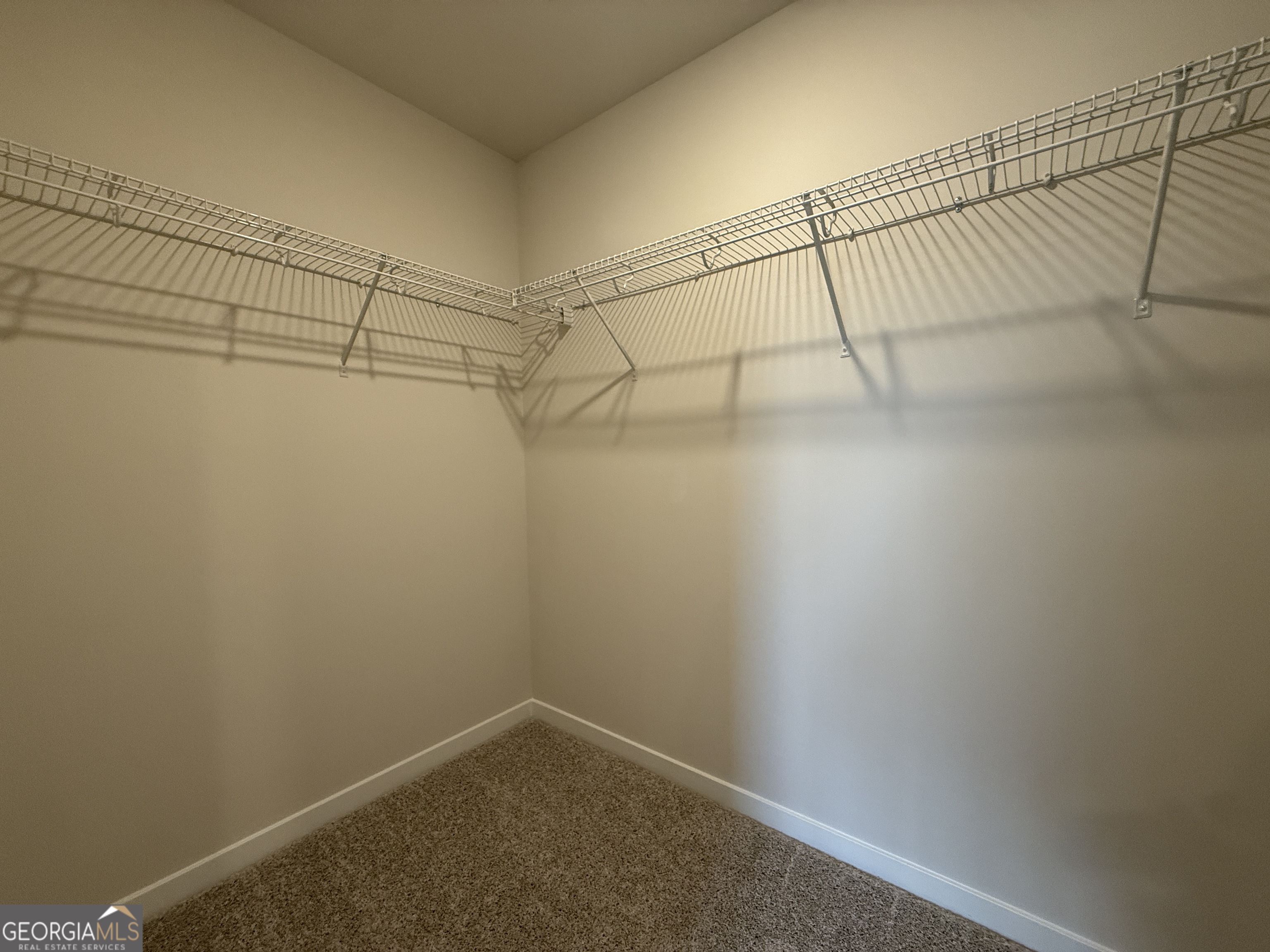 182 Depot Landing Road, Unit 65A Auburn, GA 30011 - Photo 25 of 36 a view of a room with racks on the wall