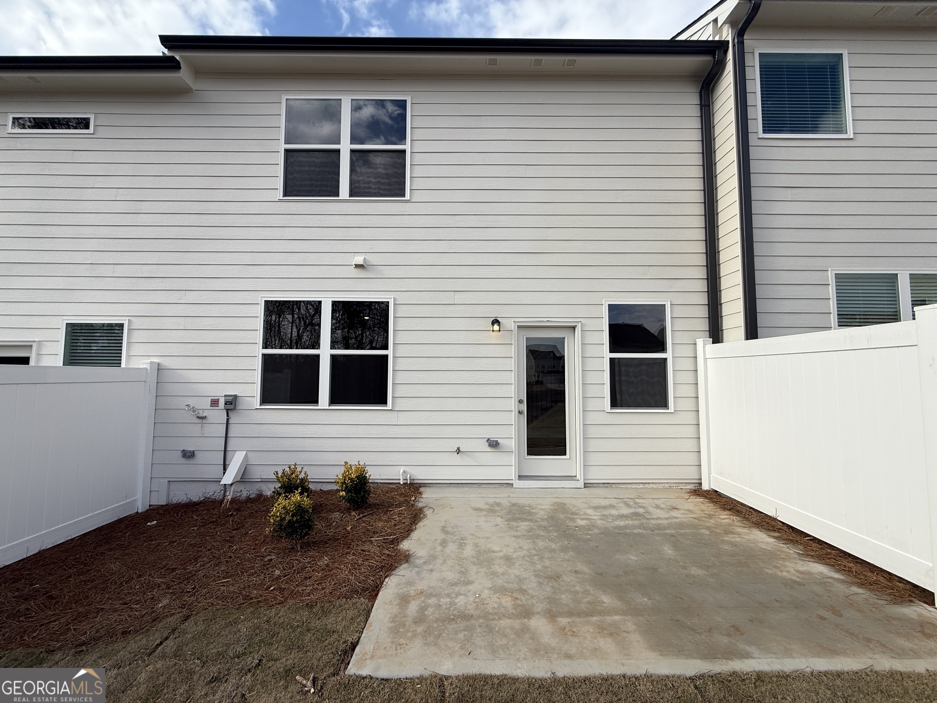 182 Depot Landing Road, Unit 65A Auburn, GA 30011 - Photo 26 of 36 a backyard of a house with seating space