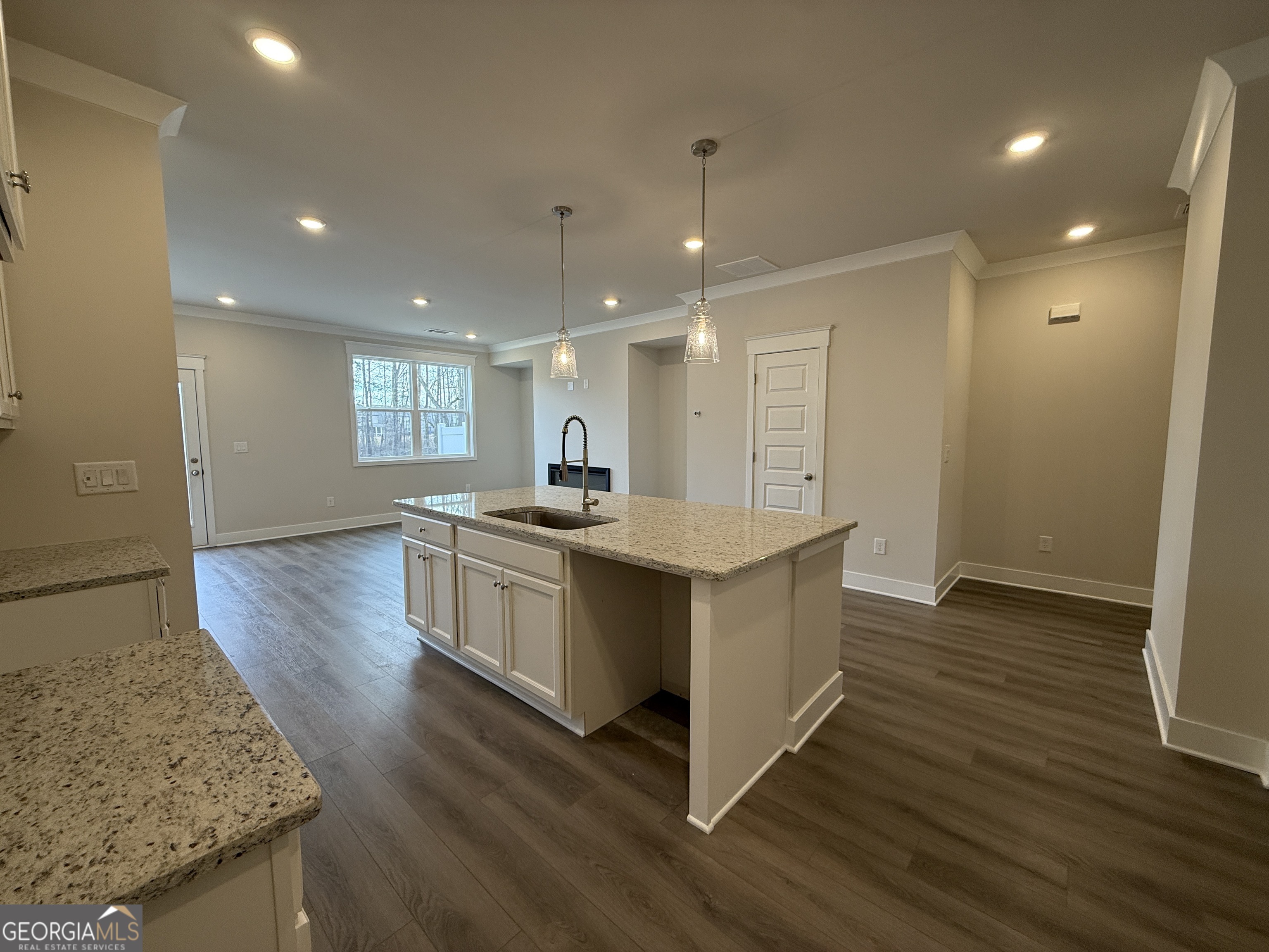 182 Depot Landing Road, Unit 65A Auburn, GA 30011 - Photo 3 of 36 a kitchen with a sink and wooden floor