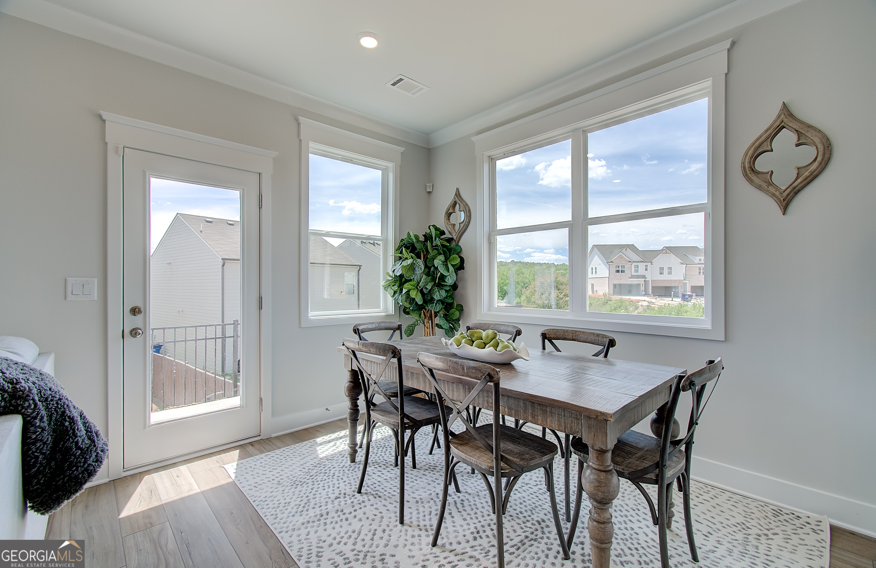 182 Depot Landing Road, Unit 65A Auburn, GA 30011 - Photo 4 of 37 a view of a dining room with furniture window and wooden floor