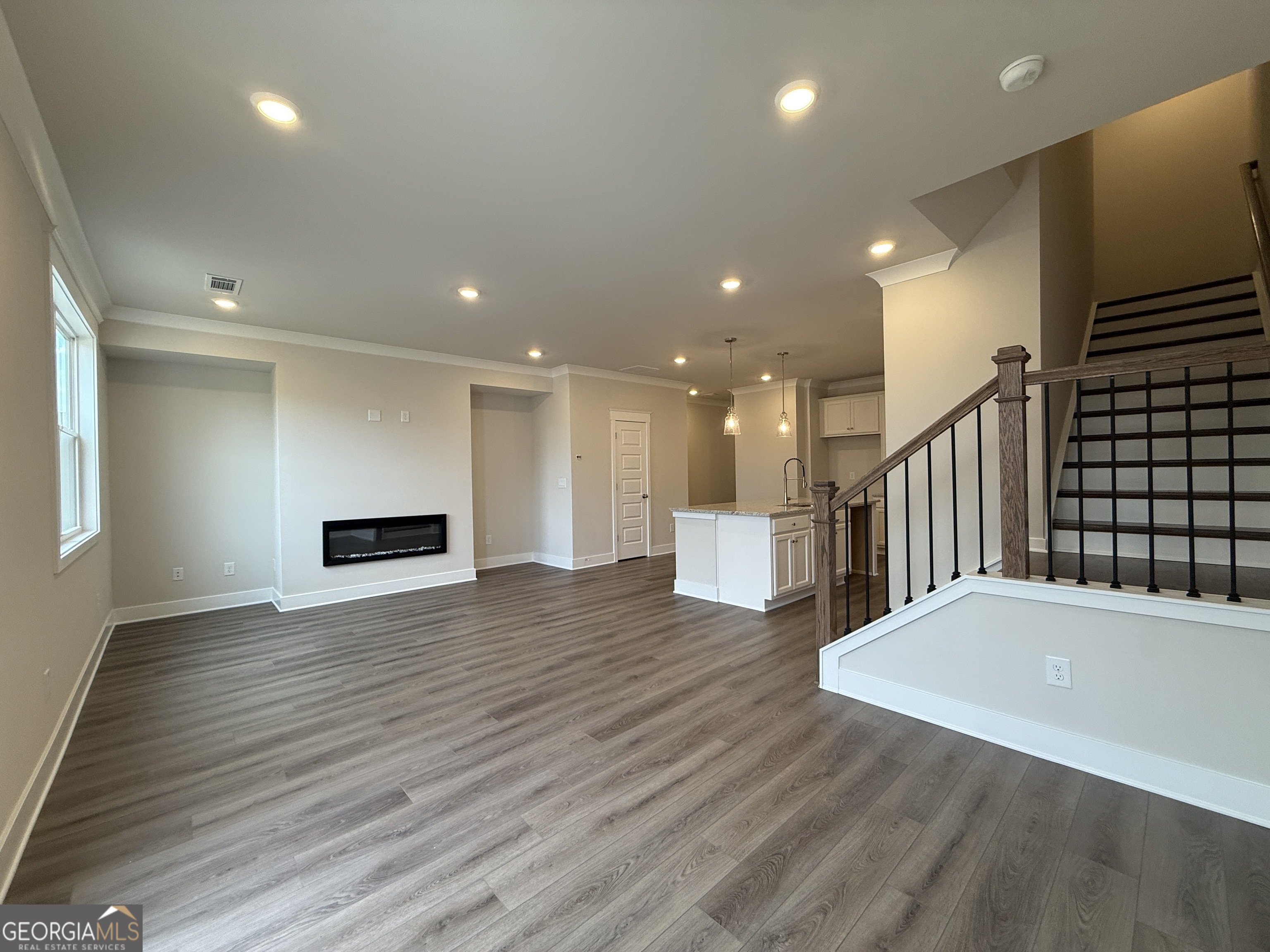 182 Depot Landing Road, Unit 65A Auburn, GA 30011 - Photo 9 of 36 a view of kitchen with furniture and wooden floor