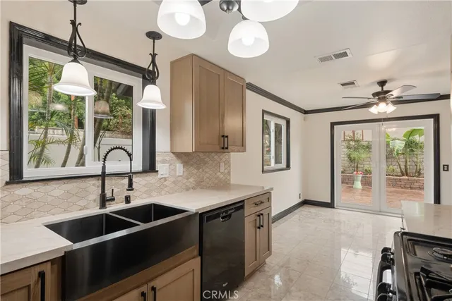 a kitchen with a sink and a large window