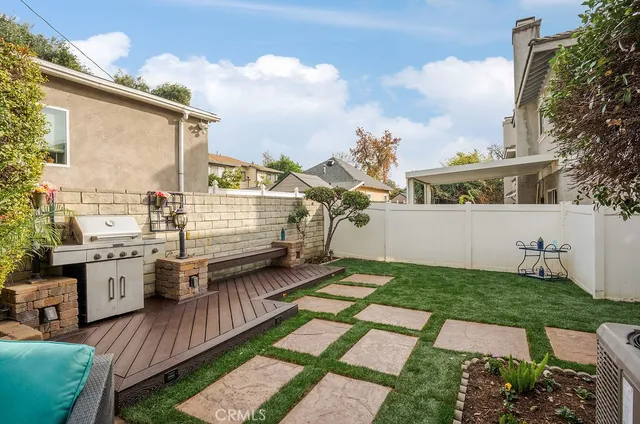 a view of a backyard with sitting area