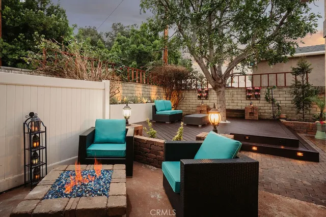 a outdoor living space with furniture and a flat screen tv