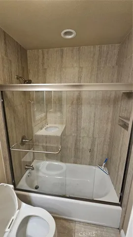 a bathroom with a bathtub and a sink