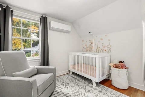 a bedroom with furniture and a window