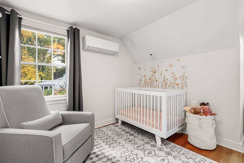 15 Bayberry Road Hingham, MA 02043 - Photo 16 of 24 a bedroom with furniture and a window